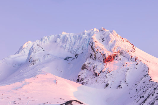 Mount Hood at sunset with golden light on snow-covered peak 