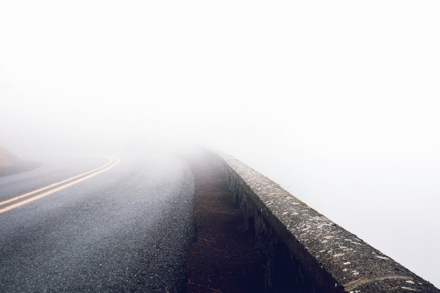 Rowena Crest curves on Oregon's Historic Columbia River Highway during a fog inversion, with serpentine road winding through thick blanket of clouds in the Columbia River Gorge - fine art landscape photography print