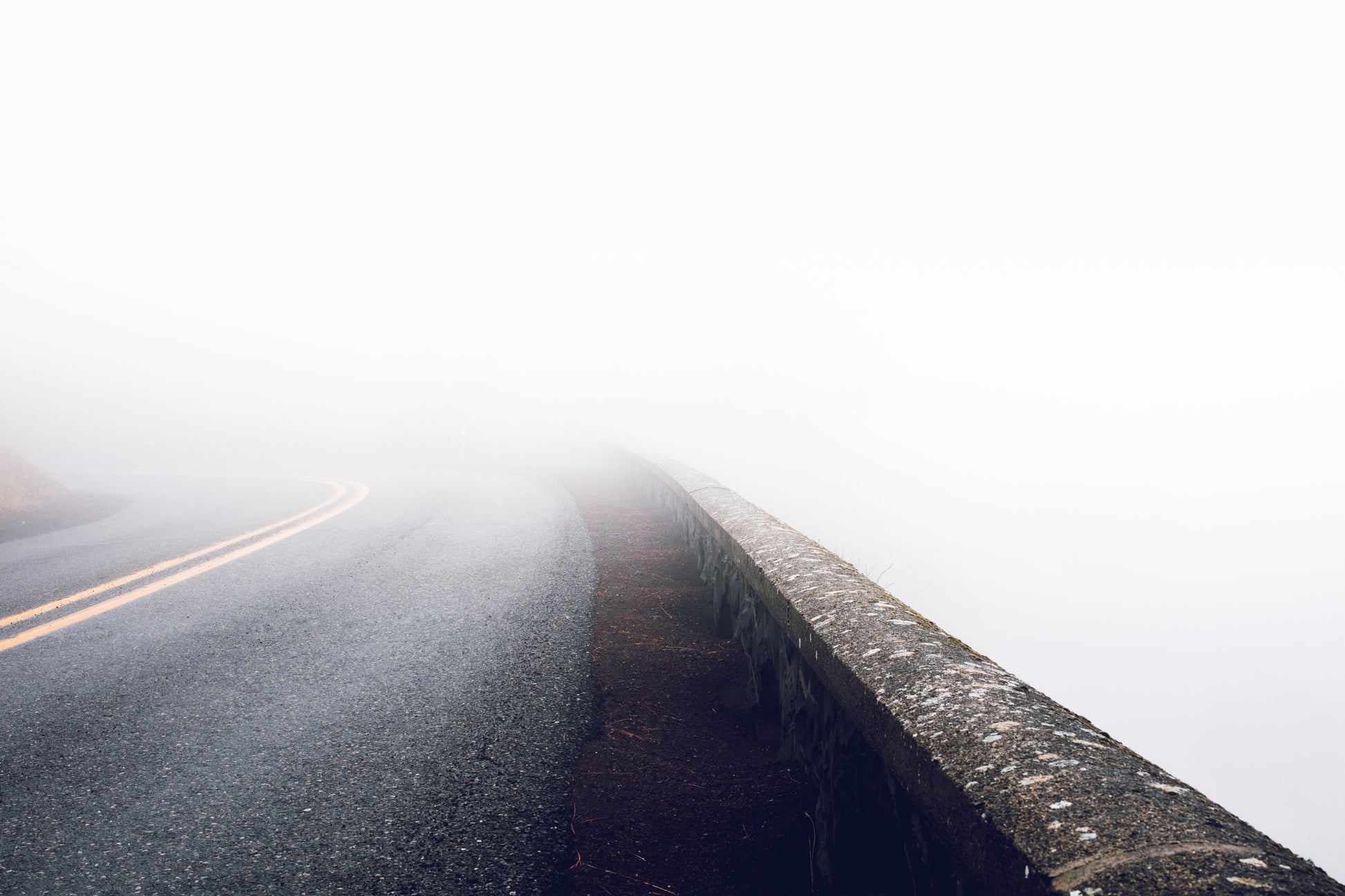 Rowena Crest curves on Oregon's Historic Columbia River Highway during a fog inversion, with serpentine road winding through thick blanket of clouds in the Columbia River Gorge - fine art landscape photography print